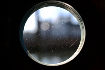 Porthole spider web
