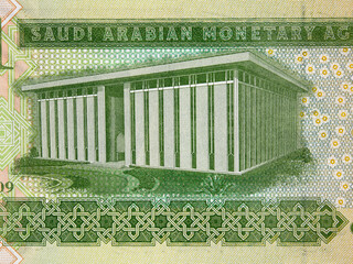 Saudi Arabia one riyal banknote macro, Saudi Arabian Monetary Agency headquarters building, money closeup - obrazy, fototapety, plakaty