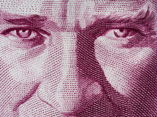 Kemal Ataturk eyes on Turkish one lira banknote close up macro, first President of Turkey, money...
