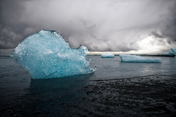 Ice on black black, next to iceland's most famous glacier jokulsarlon
