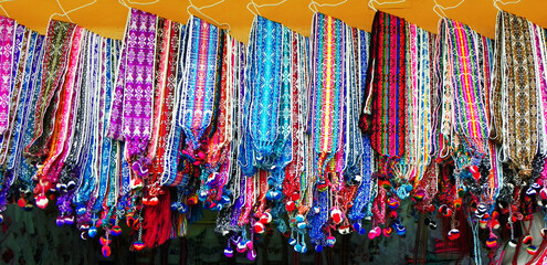 Woven colorful fabric belts in the artisan's market in Otavalo, Traditional patterns & design, Ecaudor