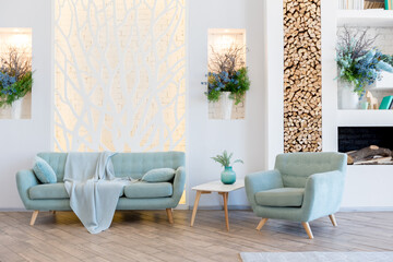 Fashionable spacious apartment with a stylish design in green, grey and white pastel colors with big window and decorative walls. bedroom and kitchen space