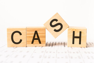 Cubes with the word CASH. Business and finance concept