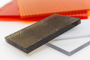 Solid Polycarbonate Sheet. Brown and transparent. Acrylic Plastic glass. Colored pc sheet on...