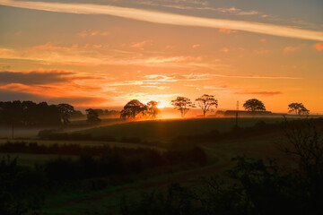 Fototapeta na wymiar Ayrshire Fields at Perceton Irvine and a Misty Sunrise in Scotland.