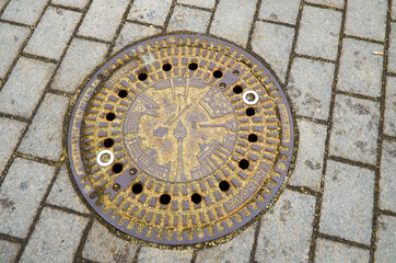 Germany. Berlin. Sewer manhole on the street of Berlin. February 17, 2018