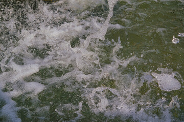 Jets of water flowing from the bowl of the fountain close-up. Sunny day.