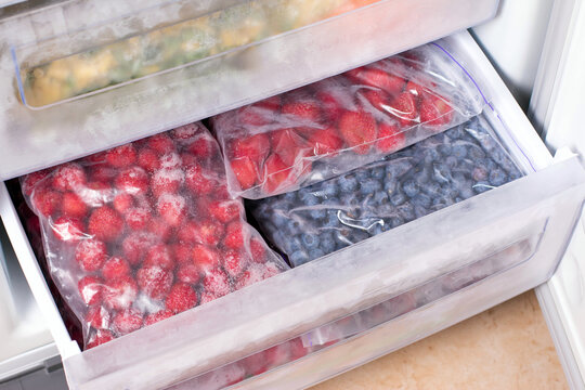 Frozen berries in plastic bags in the freezer