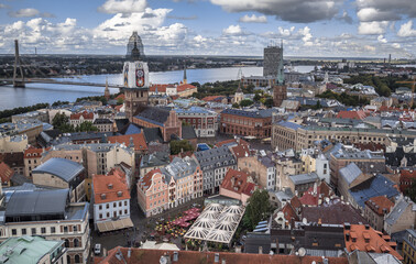 Fototapeta na wymiar Bird's eye view of the city from St. Peter's church lookout at 72 meters above ground, Riga, Latvia.