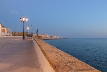 The orange sun sets over the horizon. Atlantic Ocean. Spain