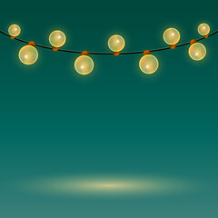 Christmas garland on a green background with a place for your design. Garland of yellow bulbs. Background with garland