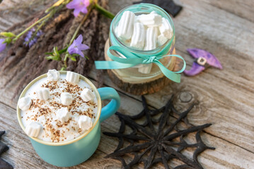 Obraz na płótnie Canvas Morning coffee with foam and marshmallows. In celebration of Halloween.