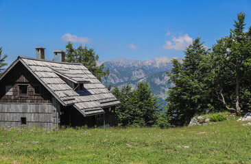 View to the wodden house in mountain Vogel Ski Resort in Slovenia during summer
