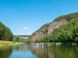 Fototapeta na wymiar Landscape, river, mountains, forests on a summer day. Rafting down the river.