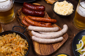 Oktoberfest dishes with beer, pretzel and sausage