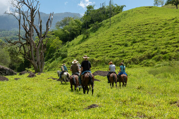 Tamesis, Antioquia, Colombia. July 1, 2018: People riding horses in the open nature