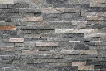 Obraz premium Decorative wall made of narrow marble tiles