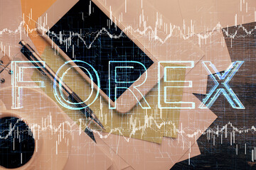 Multi exposure of forex graph hologram over desktop with phone. Top view. Mobile trade platform concept.