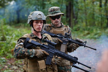 Fototapeta premium Soldier Woman as a Team Leader