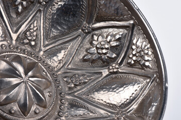 Old vintage copper bath bowl handmade with oriental ornaments isolated over white background.