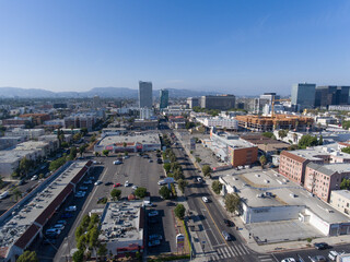 Naklejka na ściany i meble Aerial city view drone photo toward Downtown LA Los Angeles from Western Ave and 8th St around Koreatown Plaza Market