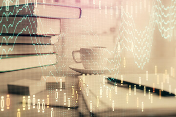 Double exposure of financial chart drawing and desktop with coffee and items on table background. Concept of forex market trading