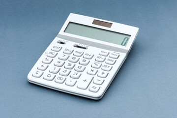 White Calculator on the color background - Studio close-up
