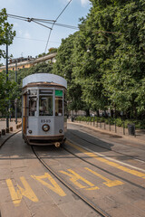 Fototapeta na wymiar A tram travels in one of the streets of an Italian city
