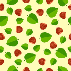 Nut seamless pattern.Vector pattern with hazelnuts in shells and green leaves on a yellow background. For the design of fabrics, packaging and wallpapers.