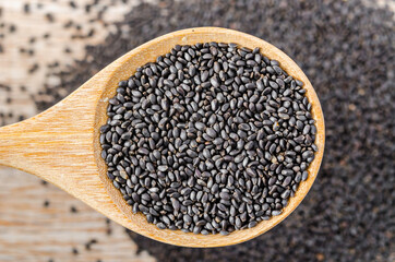Law Hairy basil or Lemon basil seeds in wooden spoon.