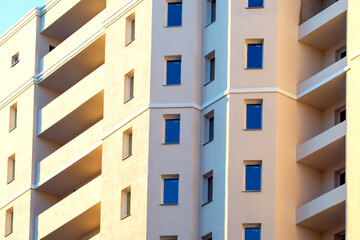 Facade of a new multi-story residential building. architecture and modern construction