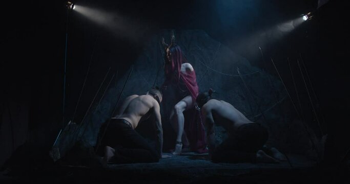 Scary succubus and two men on their knees on the leashes with blindfolds, 4k