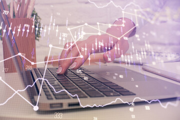 Multi exposure of woman hands typing on computer and forex chart hologram drawing. Stock market analysis concept.