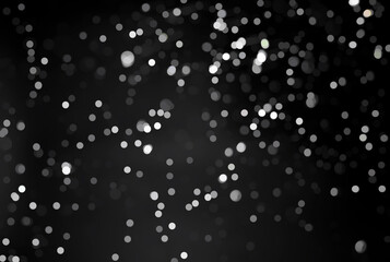 abstract bokeh light on gradient black background