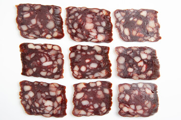 sliced ​​parts of sausage, salami on a white background. fast food and breakfast