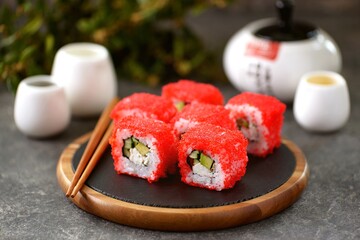 Rolls with crab meat, avocado, cucumber and tobiko caviar. Healthy japanese food.