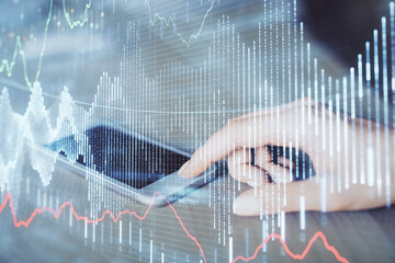 Double exposure of forex chart sketch hologram and woman holding and using a mobile device. Financial market concept.