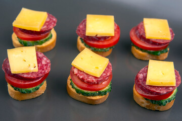 light sandwiches made of vegetables, cheese and sausages. fast food and breakfast