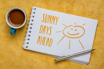 sunny days ahead inspirational note and sketch - handwriting in spiral art sketchbook against...