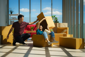 couple working together to unpacking from house moving and relocation