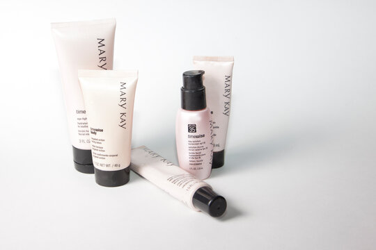 Pink bottles of Mary Kay TimeWise products for face and body