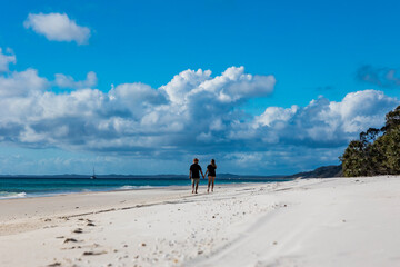 Romantic couple on white sand beach, Fraser Island