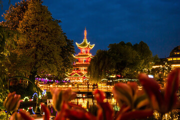 illuminated Chinese pagoda in a danish park at night