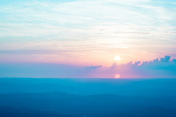 pastel colored sunset with mountains