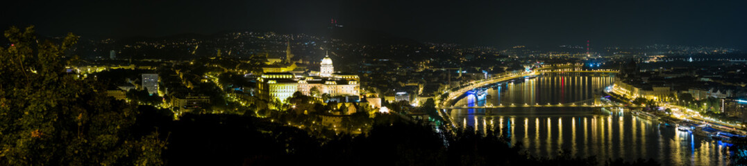 Fototapeta na wymiar View of the illuminated Buda Castle and the Chain Bridge at night in Budapest