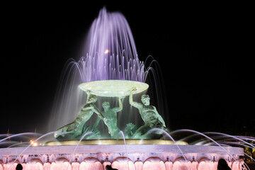 Triton Fountain illuminated in Valletta at night with a long shutter speed
