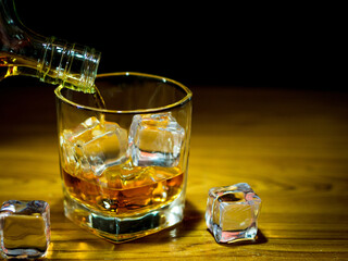 Low light photography of whiskey drinking concept