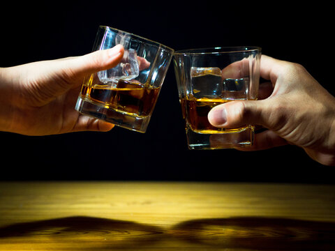Low light photography of whiskey drinking concept