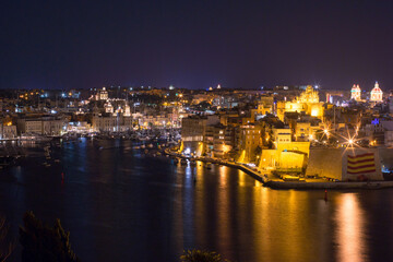 panoramic view of a bay of Valletta at night