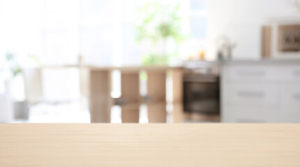 Wooden desk and blurred room on background. Home furniture